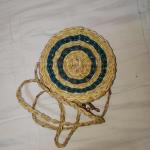 Woven circle sling bag